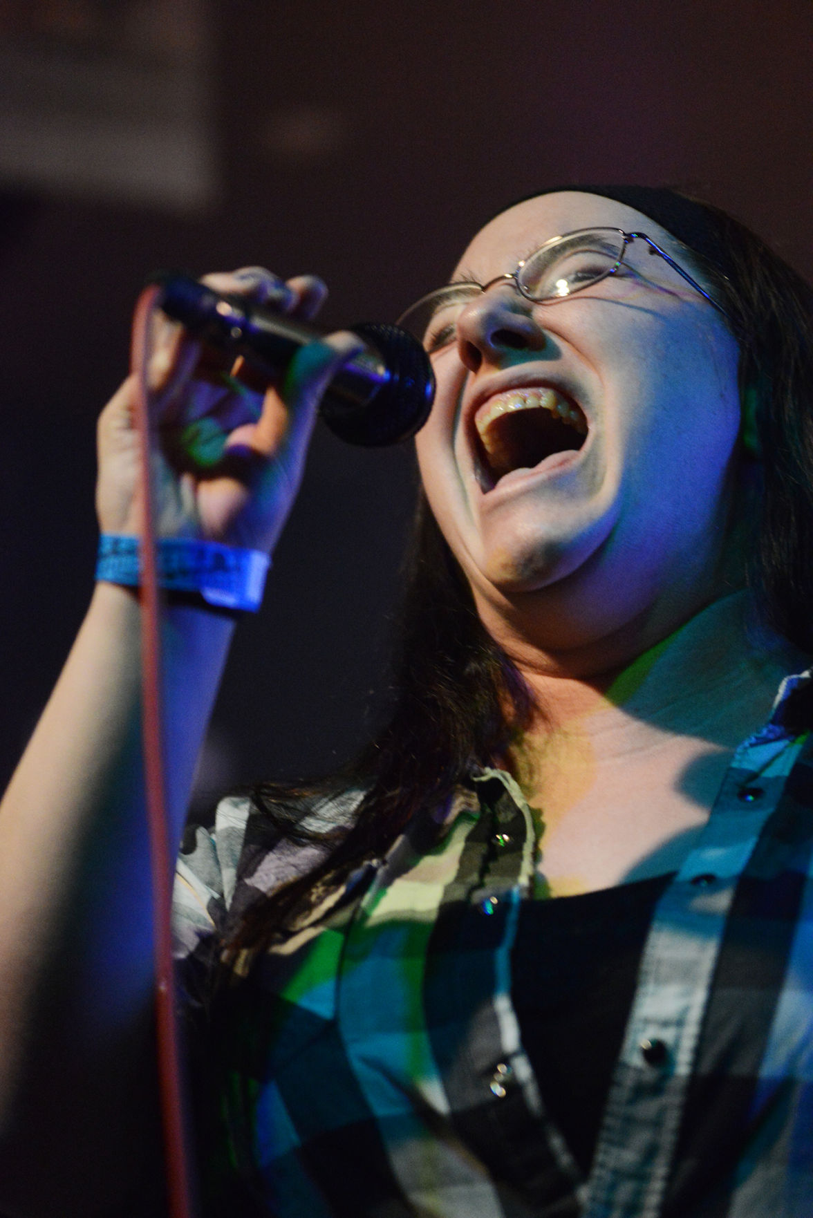 A woman karaokes at Eastside